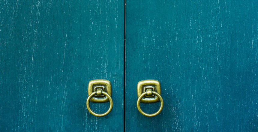 vintage wooden cupboard door with golden holder