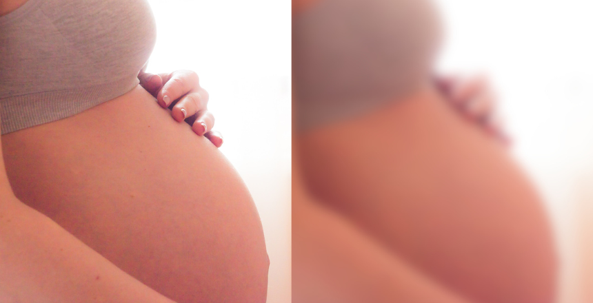Blurred image of a pregnant belly