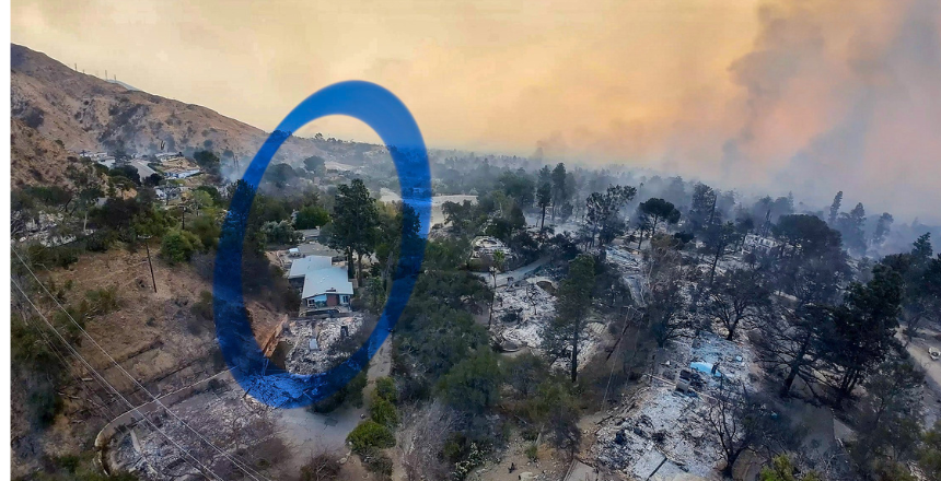 Aerial view of a fire-ravaged hillside in Altadena after the Eaton Fire, with blackened trees and ash-covered foundations surrounding a single intact, light-colored house still standing amid widespread destruction; smoke hangs in the sky.